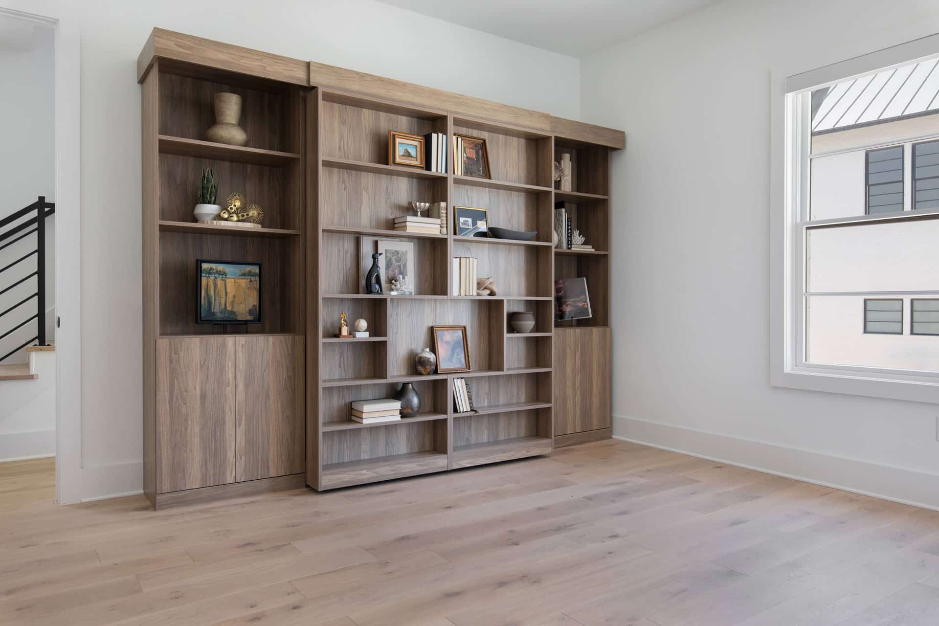 Library Murphy bed façade showcases personal style through curated book displays