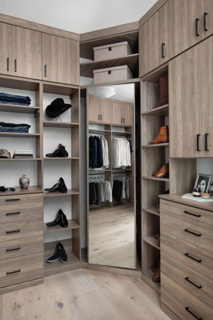 Floor-to-ceiling custom closet installation maximizes vertical space utilization